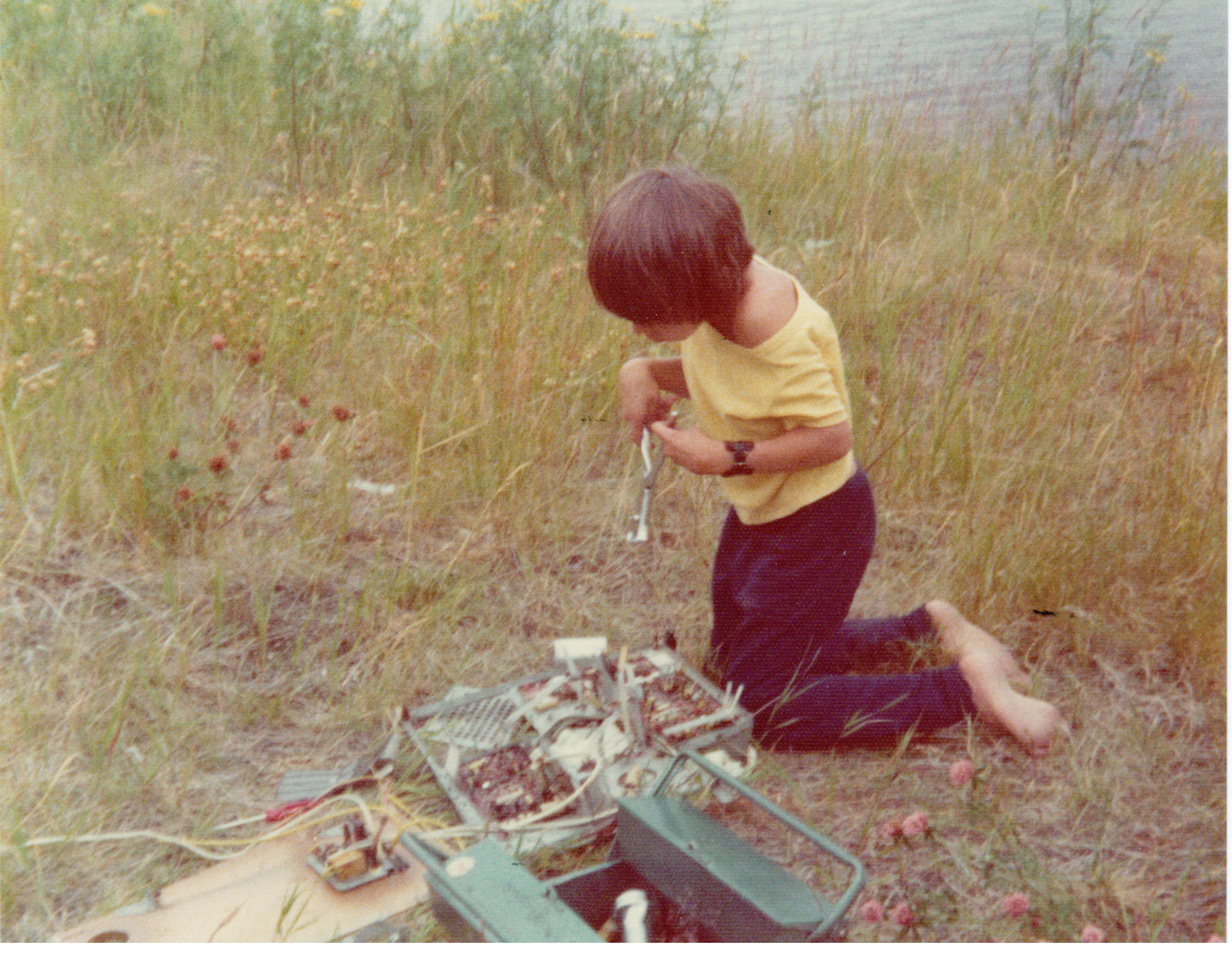 Young Mikael, age 7, fixing things with his hands