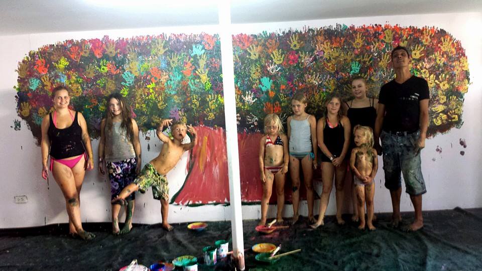 The 8 children who painted the tree's hands